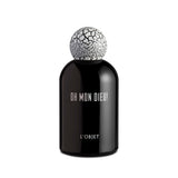 black bell shaped glass bottle with white lettering topped with a round crackle top