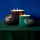 blue and green Lito candles posed together and styled with moody blue and green backgrounds