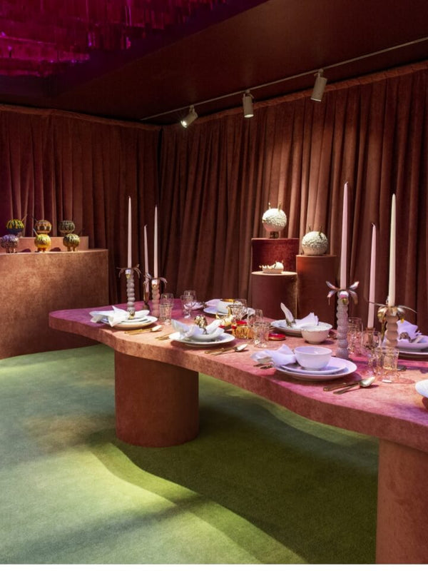 Modern interior with pink furniture and red ceiling decorations