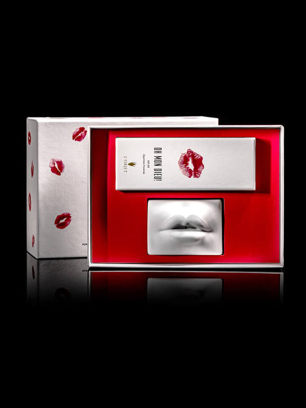 Lipstick packaging with red lipstick prints on a white background